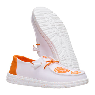 White sneakers with orange accents on a white background
