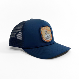 Navy blue trucker cap with a patch on a white background