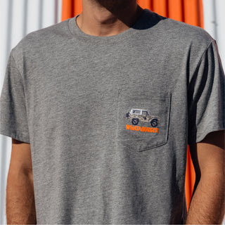 Close-up of the pocket design on the gray t-shirt showing a camo truck and orange Whataburger text.