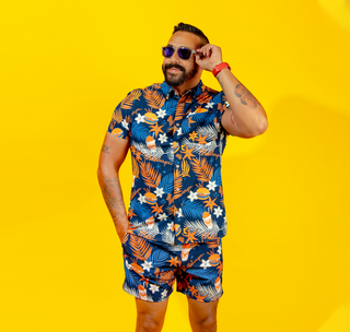 View man wearing Chubbies x Whataburger Tropical Friday Shirt and Tropical Swim Trunks
