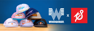 Stack of colorful Whataburger-themed Staunch Outfitters brand hats on a wooden table. Whataburger and Staunch logos on a bold blue background.