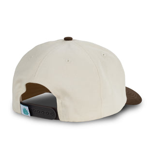 Beige cap with brown visor on a white background