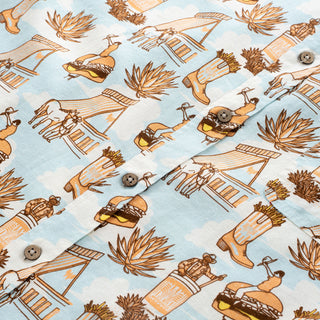 Patterned fabric with illustrations of a windmill, boots, and other elements on a light blue background.