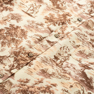 Close-up of a patterned fabric with classical scenes and buttons.