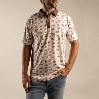 Man wearing a patterned shirt with a neutral background
