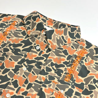 Camouflage-patterned shirt with orange accents on a white background