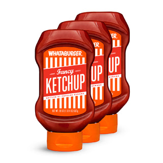 Three bottles of Whataburger Fancy Ketchup on a white background