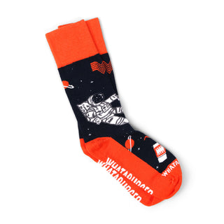 Space-themed socks with orange and black design on a white background