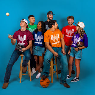 Group of young adults wearing Whataburger Tailgate Lockup tees against a blue background