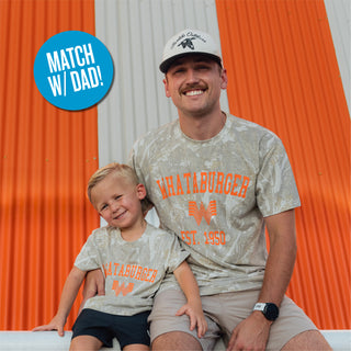 Father and son in front of orange and white striped building wearing matching Youth WHATA Drifter Camo 1950 Vintage Washed Tees.