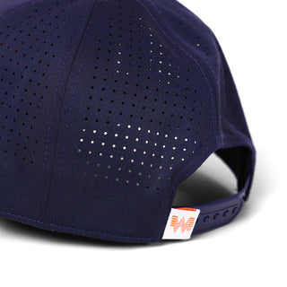 Navy blue cap with perforated design on a white background